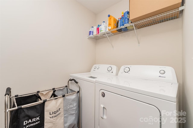 clothes washing area featuring washing machine and clothes dryer