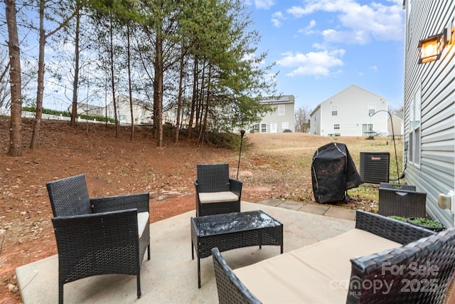 view of patio featuring an outdoor living space, area for grilling, and central AC