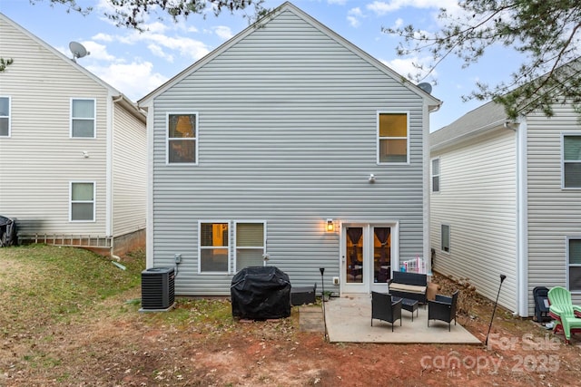 rear view of house featuring central AC and a patio