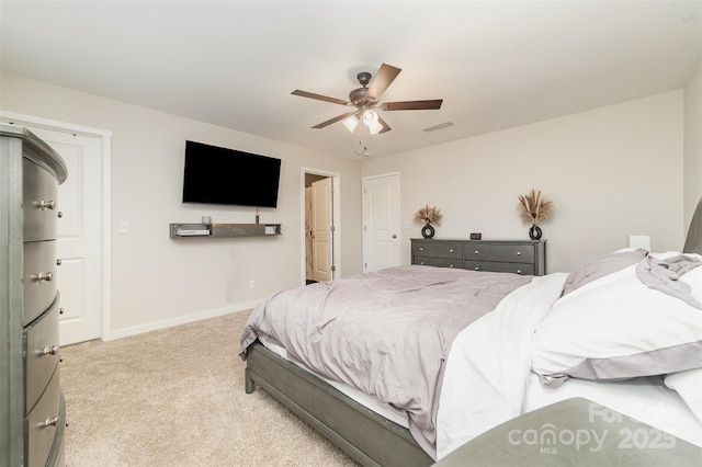 bedroom featuring light carpet, baseboards, visible vents, and ceiling fan