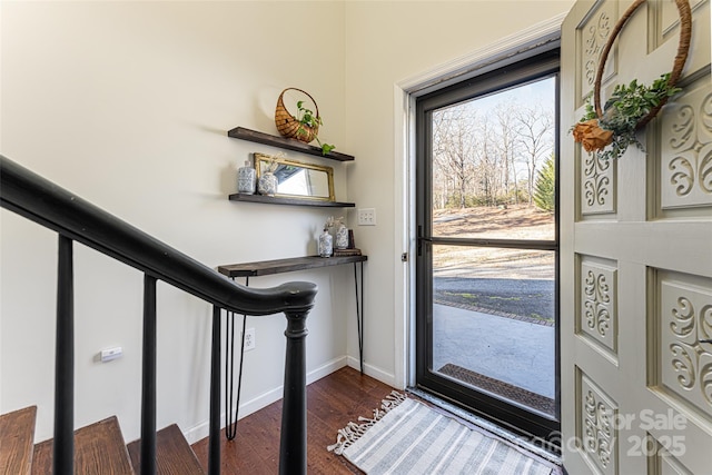 foyer entrance with dark hardwood / wood-style flooring