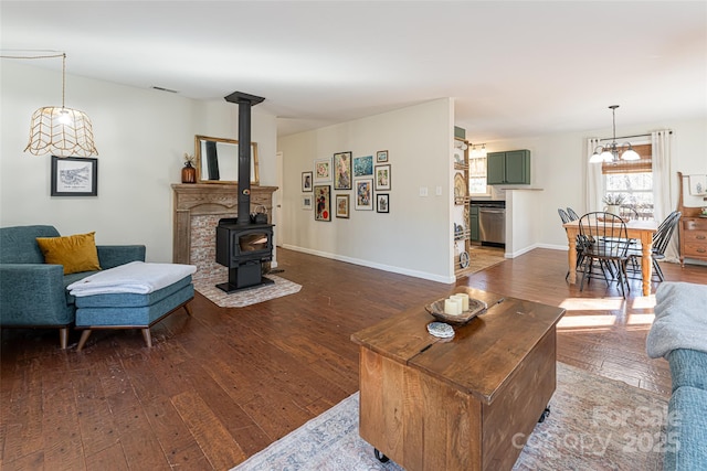 living room featuring a wood stove and hardwood / wood-style floors