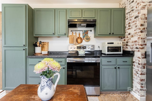 kitchen with stainless steel electric range oven and green cabinets