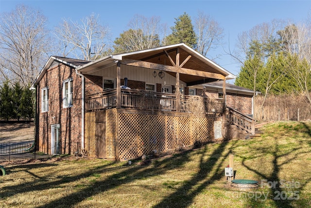 exterior space with a wooden deck and a yard