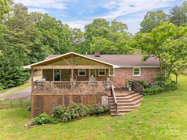 170 Hillcrest Dr, Columbus, NC 28722 - rear view of house with brick siding and a chimney