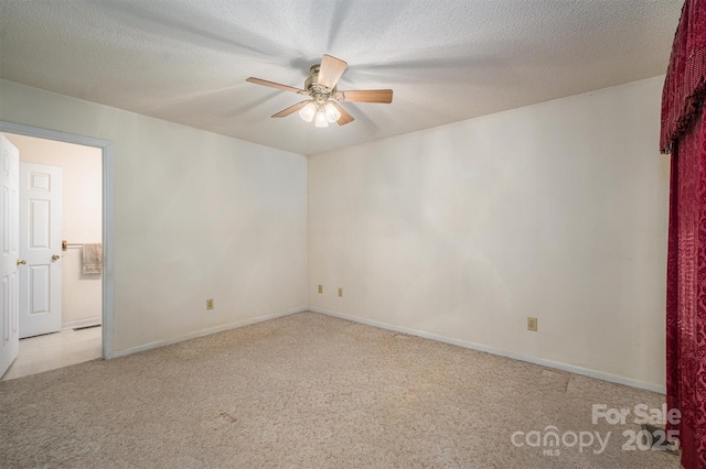 unfurnished room with ceiling fan, light carpet, and a textured ceiling