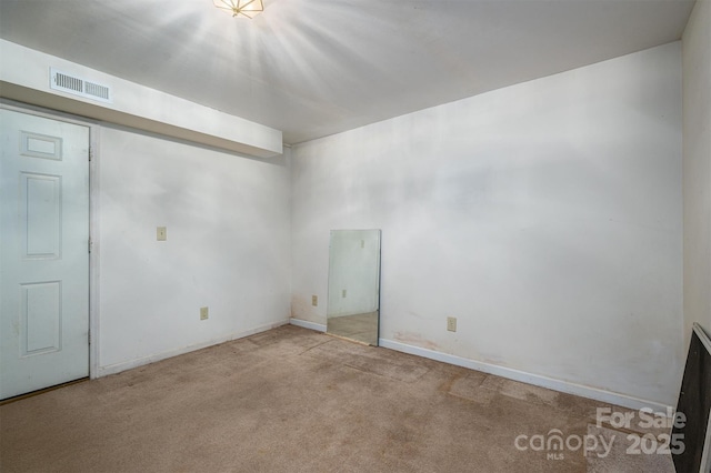 unfurnished room with light colored carpet