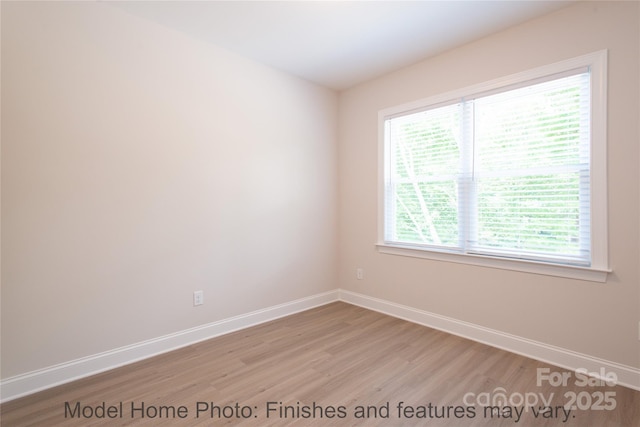 spare room featuring light hardwood / wood-style flooring