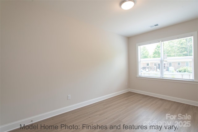 unfurnished room featuring light hardwood / wood-style floors