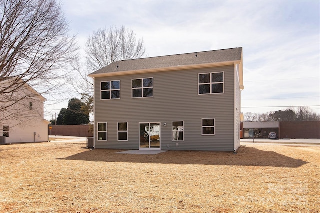 back of property with a patio