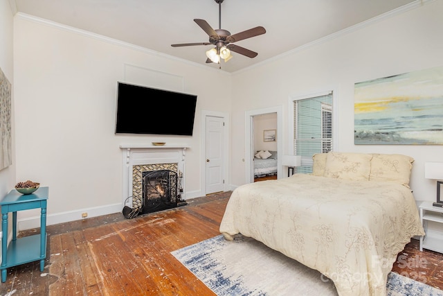 bedroom with ornamental molding, dark wood-type flooring, and ceiling fan