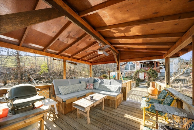 wooden deck featuring area for grilling, an outdoor hangout area, and ceiling fan