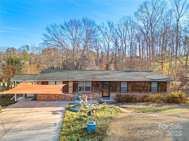 ranch-style home with a carport