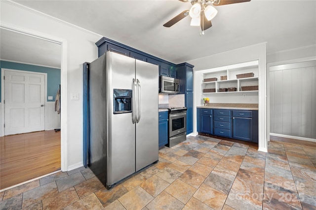 kitchen with blue cabinets, ornamental molding, appliances with stainless steel finishes, and ceiling fan