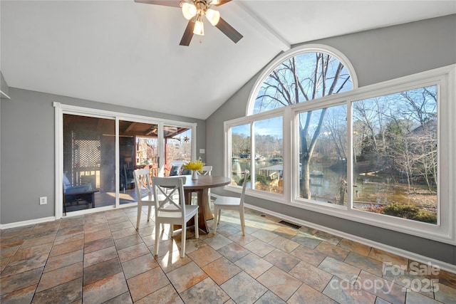 sunroom with vaulted ceiling with beams and ceiling fan