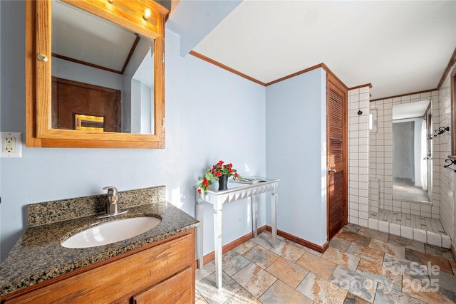 bathroom with crown molding and vanity