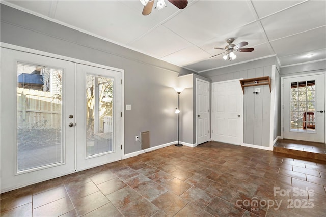 spare room featuring ornamental molding, french doors, and ceiling fan