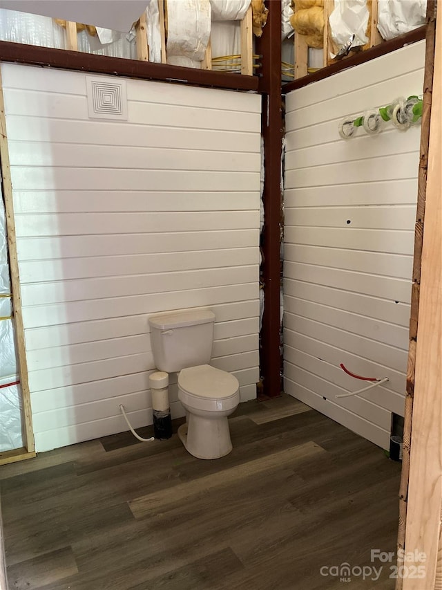 bathroom with wood-type flooring and toilet