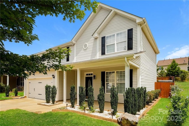 view of front facade featuring a garage, covered porch, and a front yard