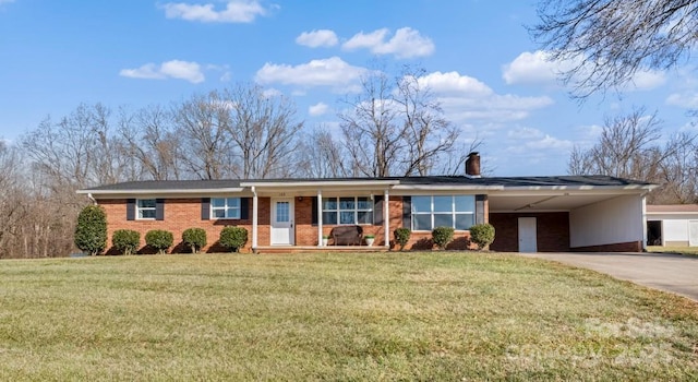 single story home featuring a carport and a front yard