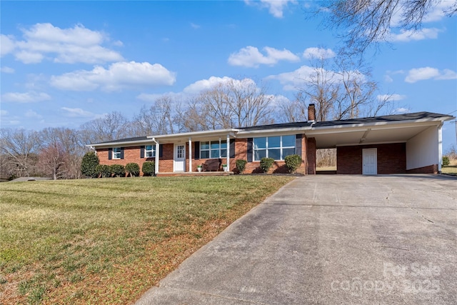 ranch-style home featuring a carport and a front yard