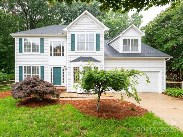 172 Foxtail Dr, Mooresville, NC 28117 - view of front of house featuring concrete driveway, a garage, and roof with shingles