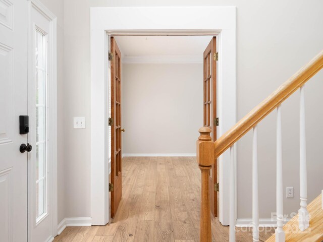 172 Foxtail Dr, Mooresville, NC 28117 - foyer entrance with crown molding, light wood finished floors, baseboards, and healthy amount of natural light