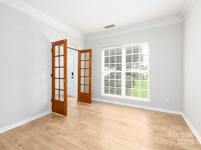 172 Foxtail Dr, Mooresville, NC 28117 - empty room featuring french doors, crown molding, baseboards, and healthy amount of natural light