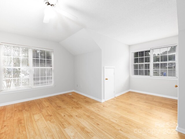 172 Foxtail Dr, Mooresville, NC 28117 - additional living space featuring wood finished floors, vaulted ceiling, baseboards, and ceiling fan