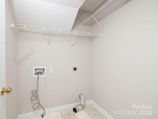 172 Foxtail Dr, Mooresville, NC 28117 - laundry area featuring hookup for an electric dryer, hookup for a washing machine, baseboards, and light tile patterned floors
