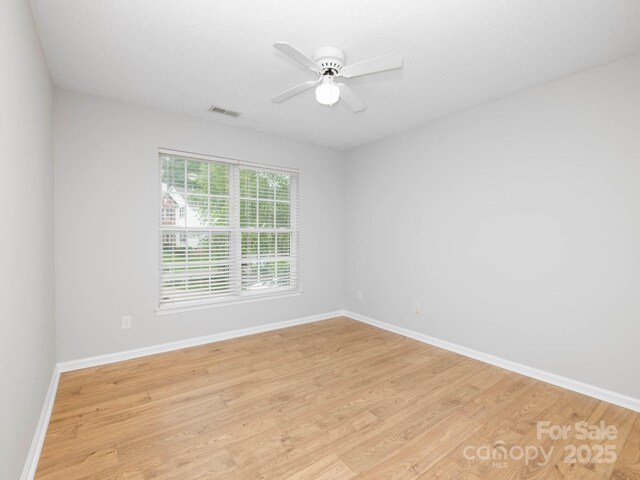 172 Foxtail Dr, Mooresville, NC 28117 - empty room featuring light wood-style floors, baseboards, and ceiling fan