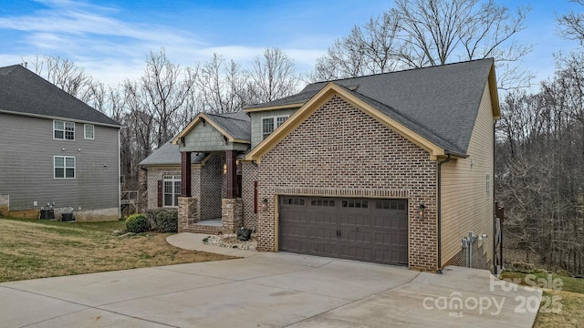 front facade with a garage and central AC