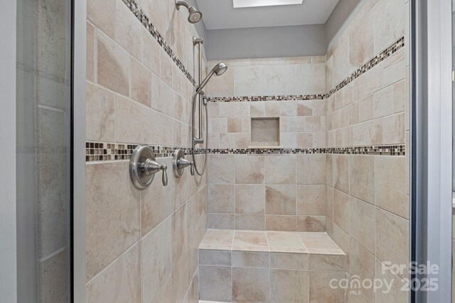 bathroom with tiled shower