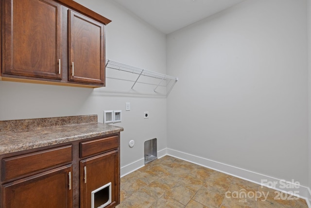 washroom featuring hookup for a washing machine, electric dryer hookup, cabinets, and hookup for a gas dryer