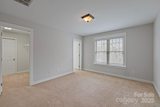 empty room with light colored carpet