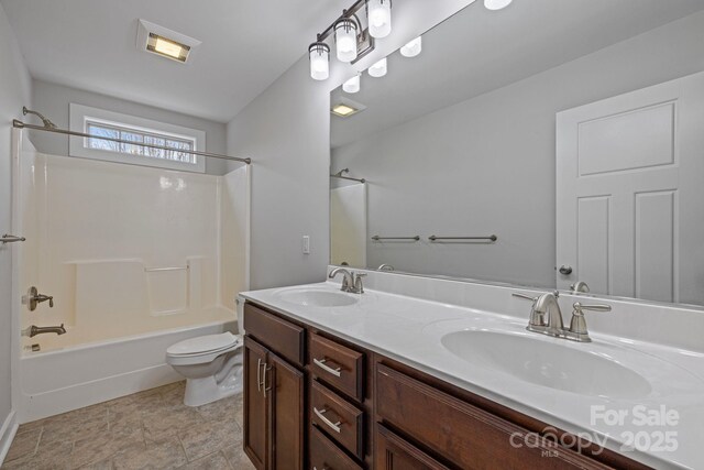 full bathroom with vanity, toilet, and washtub / shower combination