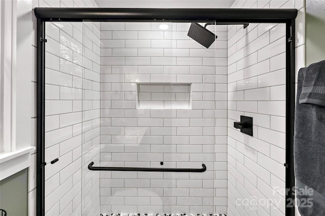 full bath featuring a shower stall