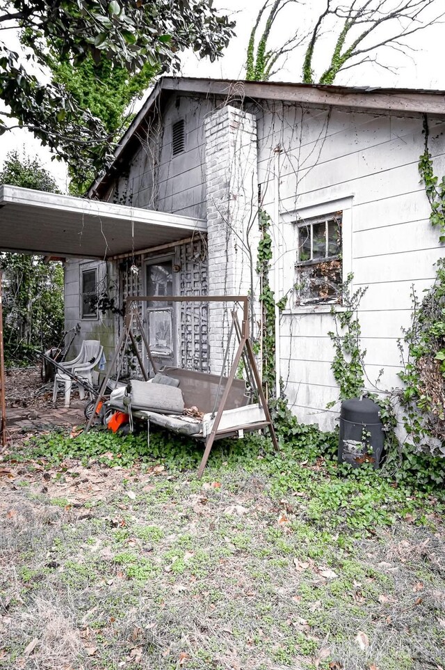 316 E 4th Ave, Gastonia, NC 28054 - back of house with a carport