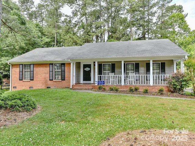 single story home with a front yard and covered porch