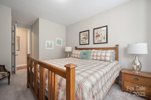 bedroom featuring light carpet