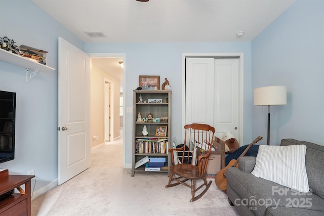 living area with light colored carpet