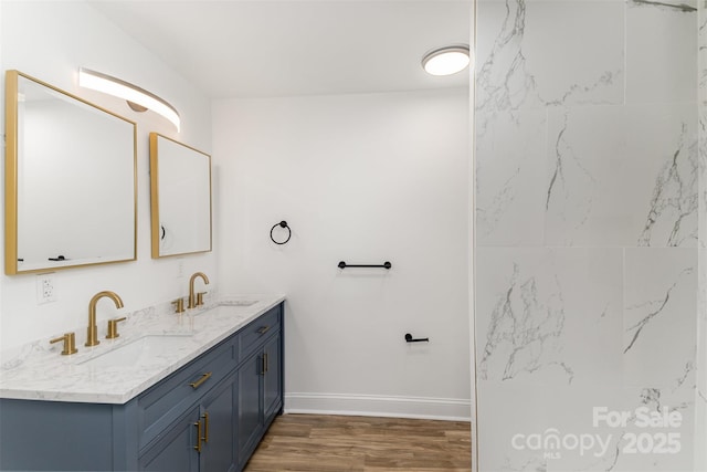 bathroom with hardwood / wood-style flooring and vanity