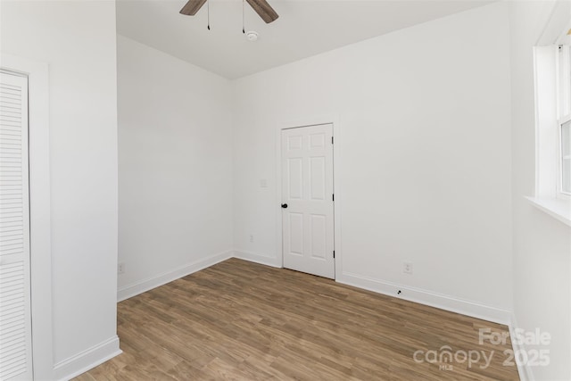 spare room featuring ceiling fan and hardwood / wood-style floors