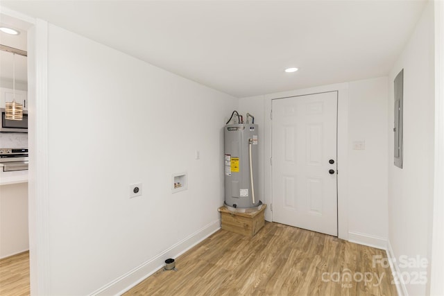 washroom featuring electric water heater, light wood-type flooring, washer hookup, and electric dryer hookup