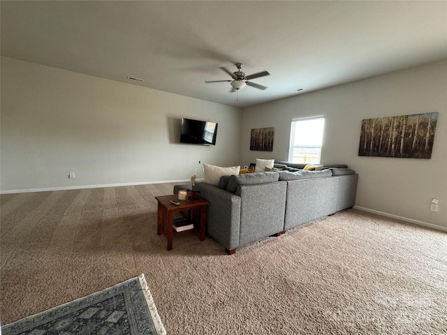 living room featuring carpet floors and ceiling fan