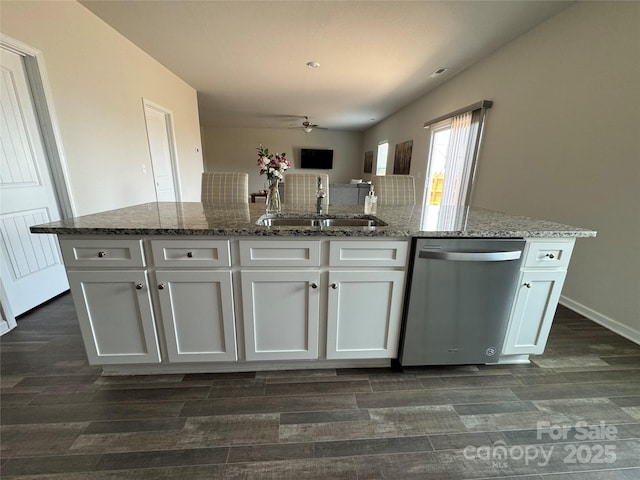 kitchen featuring stone counters, white cabinetry, sink, a kitchen island with sink, and stainless steel dishwasher