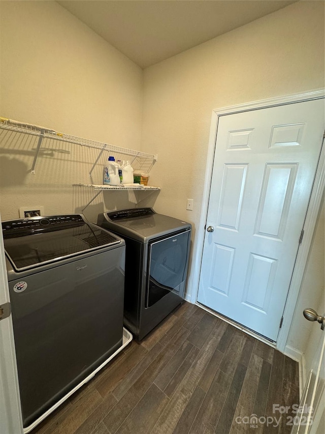 laundry room featuring independent washer and dryer and dark hardwood / wood-style flooring