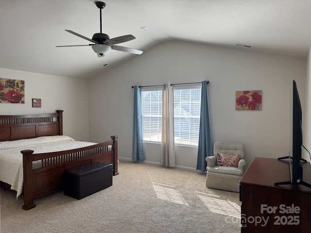 bedroom with ceiling fan, light colored carpet, and vaulted ceiling