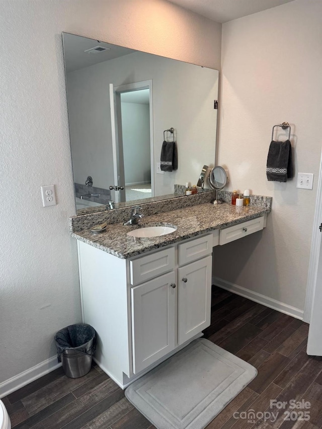 bathroom featuring vanity and hardwood / wood-style floors