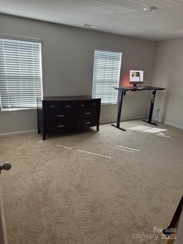 bedroom with light carpet